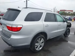 2013 Dodge Durango Crew z VIN 1C4RDJDGXDC637572, wystawiony jako IAAI lot #41922757 z przebiegiem 110 941 mil mil oraz . Historia ofert i sprzedaży dostępna na DreamBid. Obrazek 4.