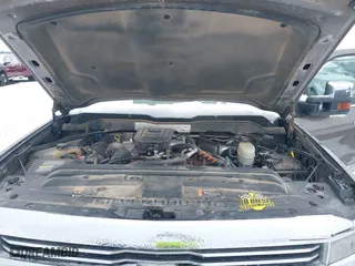2015 Chevrolet Silverado 2500HD Built After Aug 14 High Country with VIN 1GC1KXE89FF543780, listed as a IAAI auction lot 41557608 with 164,171 mi miles. Bid and sale history available at carsss.com. Image 10.
