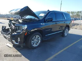 2021 GMC Yukon SLT with VIN 1GKS1BKD0MR199154, listed as a IAAI auction lot 41654239 with 105,357 mi miles. Bid and sale history available at carsss.com. Image 2.