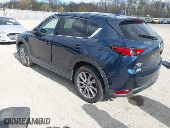 2019 Mazda CX-5 Grand Touring with VIN JM3KFBDM2K0603400, listed as a IAAI auction lot 42051135 with 59,448 mi miles and . Bid and sale history available at DreamBid. Image 3.