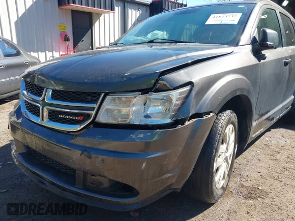 2016 Dodge Journey SE with VIN 3C4PDCAB6GT104588, listed as a IAAI auction lot 41823732 with 133,819 mi miles. Bid and sale history available at carsss.com. Image 6.