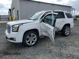 2019 GMC Yukon Denali with VIN 1GKS1CKJ6KR268230, listed as a Copart auction lot 47489035 with 49,549 mi miles and Salvage Title. Bid and sale history available at carsss.com. Image 1.