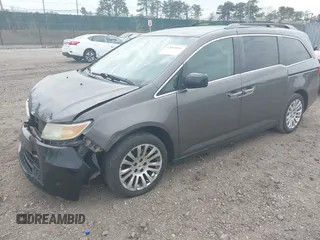 2011 Honda Odyssey EX with VIN 5FNRL5H49BB082706, listed as a IAAI auction lot 42080414 with 228,176 mi miles and . Bid and sale history available at carsss.com. Image 2.