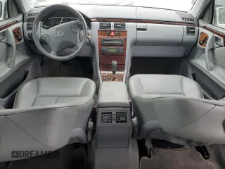 2000 Mercedes-Benz E 320 with VIN WDBJF65J1YB099417, listed as a Copart auction lot 54656915 with 130,387 mi miles and Salvage Title. Bid and sale history available at DreamBid. Image 8.