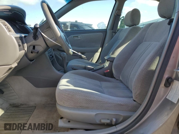 2000 Toyota Camry CE z VIN 4T1BG22K0YU692937, wystawiony jako Copart lot #57456985 z przebiegiem 116 617 mil mil oraz Szkoda całkowita • Salvage title. Historia ofert i sprzedaży dostępna na DreamBid. Obrazek 7.