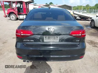 2016 Volkswagen Jetta SEL z VIN 3VWL07AJ2GM259395, wystawiony jako IAAI lot #42448235 z przebiegiem 101 032 mil mil oraz . Historia ofert i sprzedaży dostępna na DreamBid. Obrazek 16.