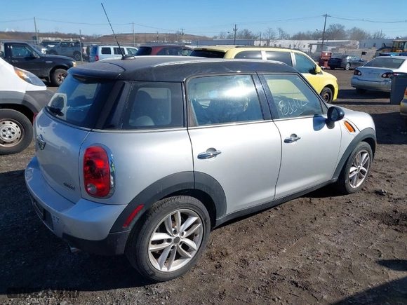 2012 MINI Cooper Countryman with VIN WMWZB3C50CWM04795, listed as a IAAI auction lot 41414790 with NaN miles. Bid and sale history available at carsss.com. Image 4.