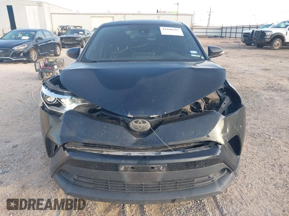 2018 Toyota C-HR XLE with VIN JTNKHMBX6J1007058, listed as a IAAI auction lot 42100587 with 71,725 mi miles and . Bid and sale history available at DreamBid. Image 13.
