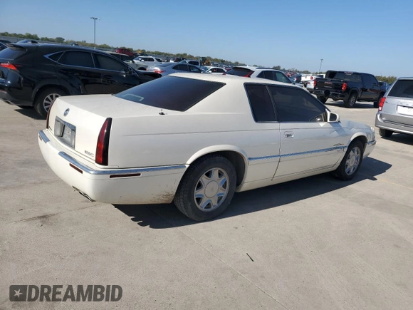 2000 Cadillac Eldorado z VIN 1G6EL12Y0YB702117, wystawiony jako Copart lot #80297854 z przebiegiem 124 851 mil mil oraz Szkoda całkowita • Salvage title. Historia ofert i sprzedaży dostępna na DreamBid. Obrazek 3.