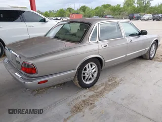1999 Jaguar XJ with VIN SAJHX1043XC856474, listed as a IAAI auction lot 41626649 with 103,266 mi miles and . Bid and sale history available at DreamBid. Image 4.
