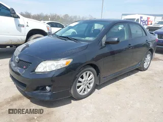 2009 Toyota Corolla with VIN 1NXBU40E29Z085117, listed as a IAAI auction lot 42059893 with 199,576 mi miles. Bid and sale history available at carsss.com. Image 2.