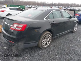 2014 Ford Taurus Limited with VIN 1FAHP2F81EG113984, listed as a IAAI auction lot 41542792 with 213,206 mi miles. Bid and sale history available at carsss.com. Image 4.