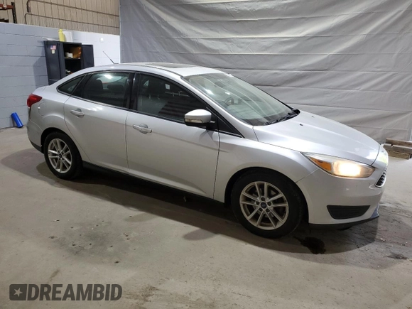 2015 Ford Focus SE with VIN 1FADP3F23FL282798, listed as a Copart auction lot 59588875 with 138,531 mi miles and Salvage title. Bid and sale history available at DreamBid. Image 4.