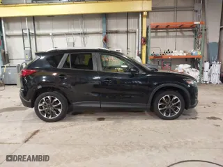 2016 Mazda CX-5 Grand Touring with VIN JM3KE2DY9G0635368, listed as a IAAI auction lot 41699616 with 240,619 mi miles. Bid and sale history available at carsss.com. Image 14.