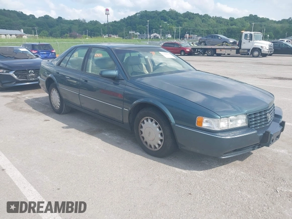 1993 Cadillac Seville STS z VIN 1G6KY5298PU821640, wystawiony jako IAAI lot #42269233 z przebiegiem 126 662 mil mil oraz . Historia ofert i sprzedaży dostępna na DreamBid. Obrazek 1.