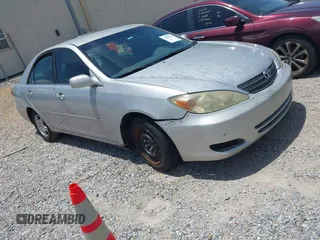 2002 Toyota Camry XLE z VIN 4T1BF32K42U531992, wystawiony jako IAAI lot #42294926 z przebiegiem 294 929 mil mil oraz . Historia ofert i sprzedaży dostępna na DreamBid. Obrazek 1.
