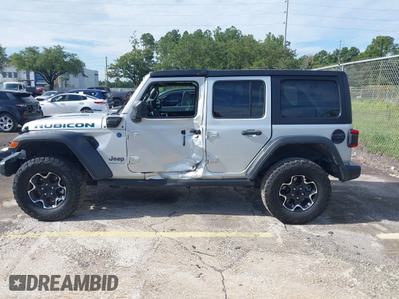 2023 Jeep Wrangler Rubicon with VIN 1C4JJXR63PW703424, listed as a IAAI auction lot 42639653 with 46,412 mi miles and . Bid and sale history available at DreamBid. Image 13.