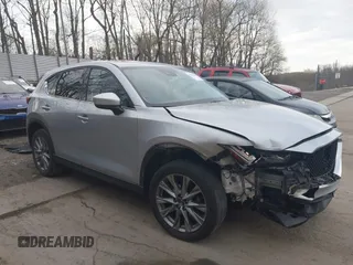 2021 Mazda CX-5 Grand Touring with VIN JM3KFBDM8M1394158, listed as a IAAI auction lot 42079644 with 85,932 mi miles and . Bid and sale history available at DreamBid. Image 1.