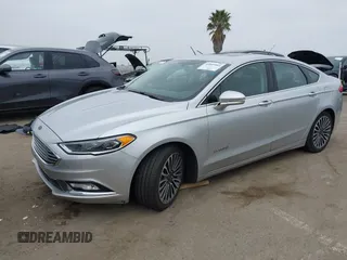 2017 Ford Fusion Hybrid Titanium z VIN 3FA6P0RU7HR300311, wystawiony jako IAAI lot #42045664 z przebiegiem 136 231 mil mil oraz . Historia ofert i sprzedaży dostępna na DreamBid. Obrazek 18.