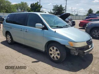 2004 Honda Odyssey EX-L with VIN 5FNRL18014B015462, listed as a Copart auction lot 62834665 with 323,817 mi miles and Salvage title. Bid and sale history available at DreamBid. Image 4.