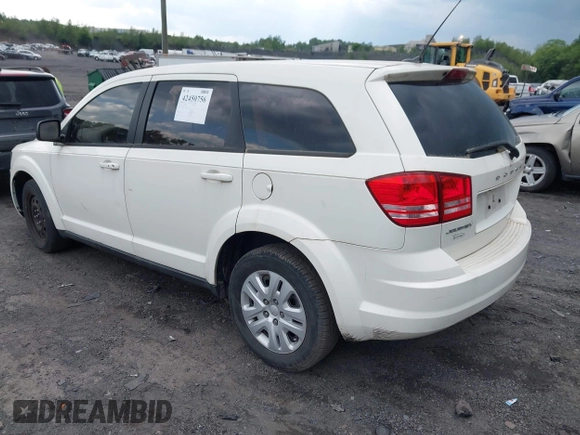 2013 Dodge Journey SE with VIN 3C4PDCAB7DT695493, listed as a IAAI auction lot 42450756 with 153,064 mi miles and . Bid and sale history available at DreamBid. Image 3.