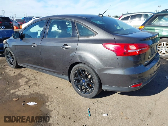 2016 Ford Focus SE z VIN 1FADP3F27GL321507, wystawiony jako IAAI lot #41278203 z przebiegiem 157 910 mil mil oraz . Historia ofert i sprzedaży dostępna na DreamBid. Obrazek 3.