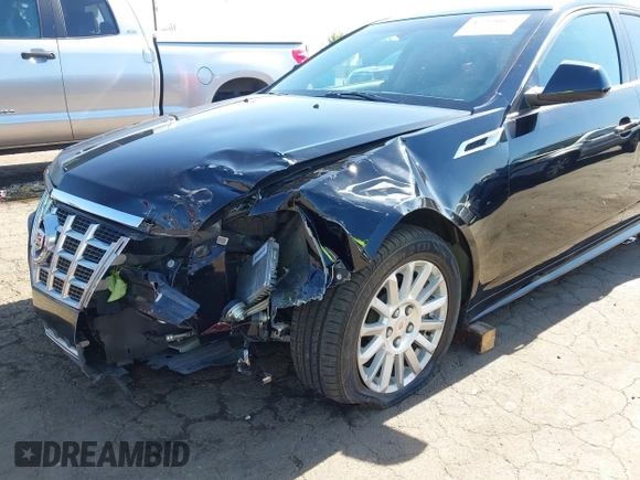 2013 Cadillac CTS Luxury with VIN 1G6DE5E51D0165634, listed as a IAAI auction lot 42208023 with 92,827 mi miles and . Bid and sale history available at DreamBid. Image 6.