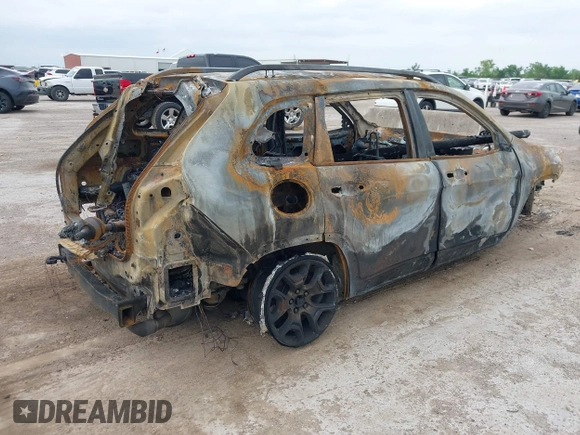 2022 Jeep Cherokee Trailhawk with VIN 1C4PJMBX4ND517170, listed as a IAAI auction lot 42136339 with Not provided miles and . Bid and sale history available at DreamBid. Image 4.