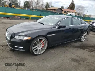 2014 Jaguar XJ Portfolio with VIN SAJWJ2GD4E8V69651, listed as a Copart auction lot 52426195 with 56,413 mi miles and Salvage title. Bid and sale history available at DreamBid. Image 1.