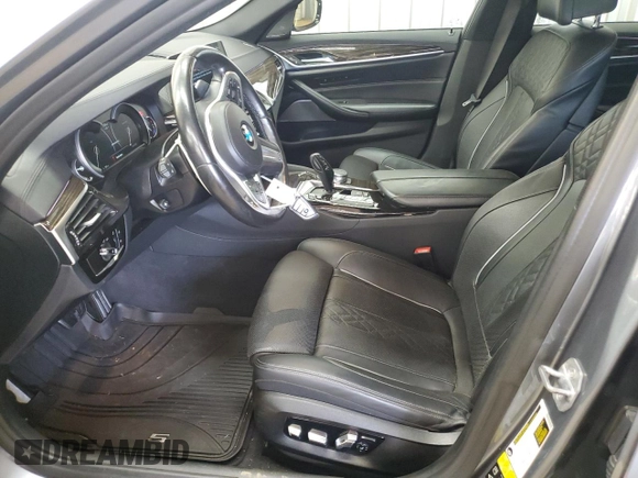 2018 BMW 5 Series M550i xDrive with VIN WBAJB9C55JB050213, listed as a Copart auction lot 61714255 with 34,700 mi miles and Salvage title. Bid and sale history available at DreamBid. Image 7.