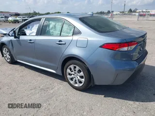 2023 Toyota Corolla Hybrid LE with VIN JTDBCMFE8PJ010693, listed as a IAAI auction lot 41736641 with 10,751 mi miles. Bid and sale history available at carsss.com. Image 3.