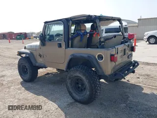 2005 Jeep Wrangler SE with VIN 1J4FA29S25P328827, listed as a IAAI auction lot 41917807 with 157,562 mi miles. Bid and sale history available at carsss.com. Image 3.