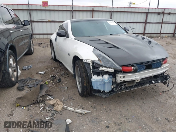 2016 Nissan 370Z Sport z VIN JN1AZ4EH1GM930883, wystawiony jako IAAI lot #41909945 z przebiegiem 80 484 mil mil oraz . Historia ofert i sprzedaży dostępna na DreamBid. Obrazek 1.