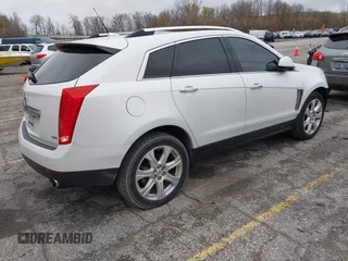 2014 Cadillac SRX Premium Collection z VIN 3GYFNDE34ES548826, wystawiony jako IAAI lot #40792942 z przebiegiem 115 984 mil mil oraz . Historia ofert i sprzedaży dostępna na DreamBid. Obrazek 4.