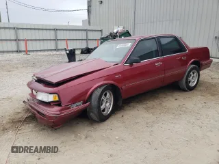 1996 Oldsmobile Cutlass Ciera 1SA VX5 z VIN 1G3AJ55M9T6322910, wystawiony jako Copart lot #84450064 z przebiegiem 163 709 mil mil oraz Szkody całkowita. Historia ofert i sprzedaży dostępna na DreamBid. Obrazek 1.