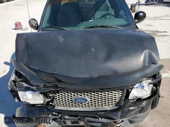 2000 Ford F-150 XL с VIN 1FTZX0726YKB47787, выставлен на аукционе Copart как лот 49712445 с пробегом Не указан миль и Списание • Salvage title. История ставок и продаж доступна на DreamBid. Изображение 11.