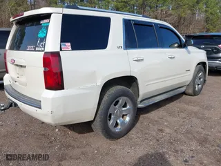 2015 Chevrolet Tahoe LTZ with VIN 1GNSCCKC2FR140524, listed as a IAAI auction lot 41592878 with 284,785 mi miles. Bid and sale history available at carsss.com. Image 4.