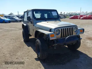 2005 Jeep Wrangler Sport with VIN 1J4FA49S65P342497, listed as a IAAI auction lot 41674606 with 123,457 mi miles. Bid and sale history available at carsss.com. Image 1.