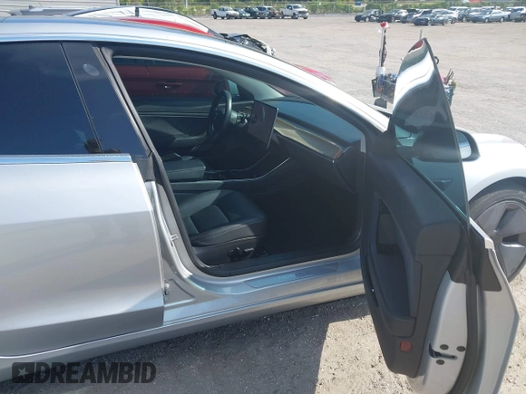 2018 Tesla Model 3 Long Range Battery with VIN 5YJ3E1EB7JF104356, listed as a IAAI auction lot 41936961 with 90,932 mi miles and . Bid and sale history available at DreamBid. Image 5.