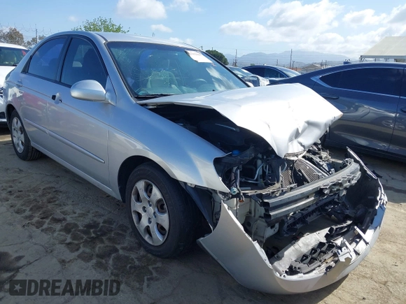 2005 Kia Spectra LX with VIN KNAFE122355139496, listed as a IAAI auction lot 41955660 with 58,676 mi miles. Bid and sale history available at carsss.com. Image 1.