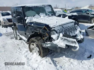 2014 Jeep Wrangler Sport with VIN 1C4AJWAG5EL285994, listed as a IAAI auction lot 41558673 with 98,779 mi miles and . Bid and sale history available at carsss.com. Image 1.