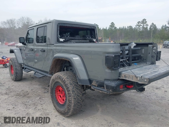 2021 Jeep Gladiator Rubicon with VIN 1C6JJTBG7ML554354, listed as a IAAI auction lot 41796943 with 61,513 mi miles and . Bid and sale history available at DreamBid. Image 3.