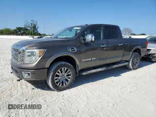 2016 Nissan Titan XD Platinum Reserve with VIN 1N6BA1F21GN506919, listed as a Copart auction lot 52977235 with 134,751 mi miles and Salvage Title. Bid and sale history available at carsss.com. Image 1.
