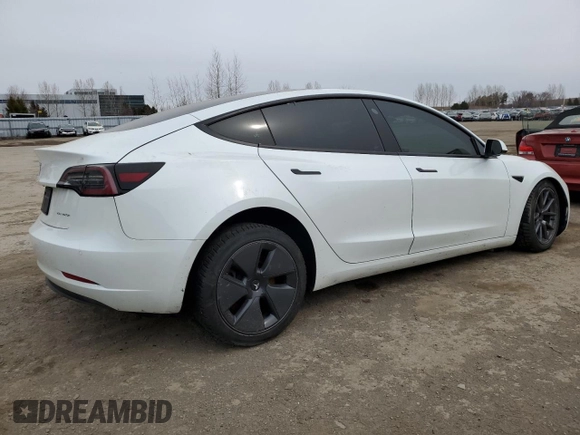 2022 Tesla Model 3 Long Range with VIN 5YJ3E1EB3NF353131, listed as a Copart auction lot 52582025 with 68,745 mi miles and Salvage Title. Bid and sale history available at carsss.com. Image 3.