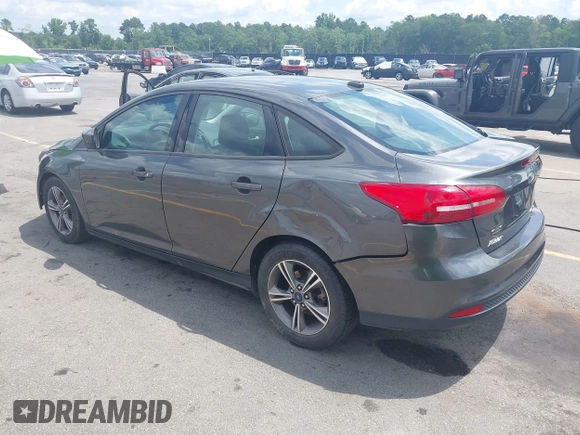 2018 Ford Focus SE with VIN 1FADP3FE2JL263954, listed as a IAAI auction lot 42480748 with 111,059 mi miles and . Bid and sale history available at DreamBid. Image 3.