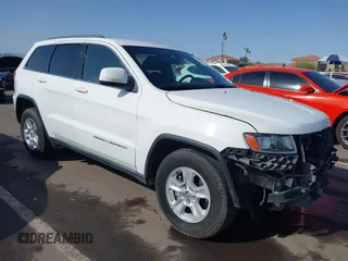 2014 Jeep Grand Cherokee Laredo with VIN 1C4RJEAG3EC125478, listed as a IAAI auction lot 41938499 with 167,588 mi miles and . Bid and sale history available at DreamBid. Image 1.
