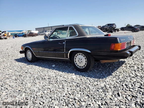 1986 Mercedes-Benz 560 Series 560SL with VIN WDBBA48D4GA045126, listed as a Copart auction lot 52407205 with 123,042 mi miles and Clean Title. Bid and sale history available at carsss.com. Image 2.