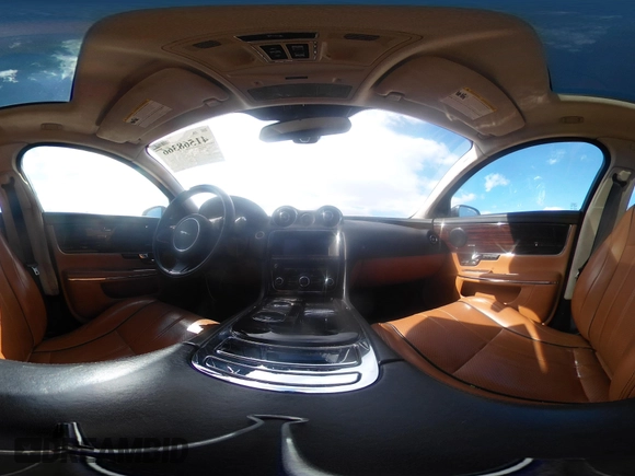 2013 Jaguar XJ Portfolio with VIN SAJWJ2GDXD8V55879, listed as a IAAI auction lot 41568366 with 121,119 mi miles and . Bid and sale history available at DreamBid. Image 18.