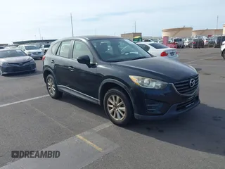 2016 Mazda CX-5 Sport with VIN JM3KE2BY0G0649274, listed as a IAAI auction lot 42677015 with 116,226 mi miles and . Bid and sale history available at DreamBid. Image 1.