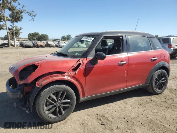 2014 MINI Countryman with VIN WMWZB3C5XEWR42035, listed as a Copart auction lot 61846725 with 105,131 mi miles and Salvage title. Bid and sale history available at DreamBid. Image 1.